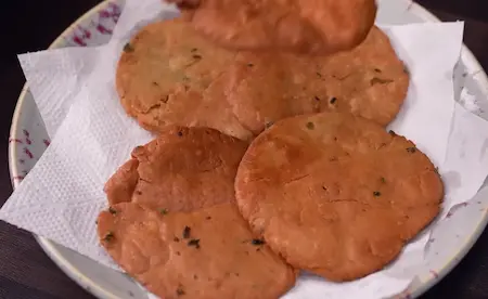 Step 4: Second frying of Aligarh Kachori in hot oil until golden brown and crispy