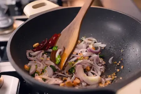 Sautéed onions and garlic in a pan