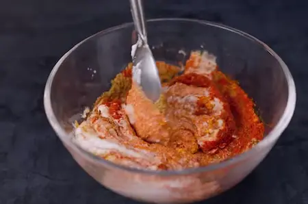 Curd mixture being added to the masala