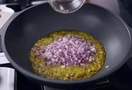 Sautéing onions and spices in mustard oil