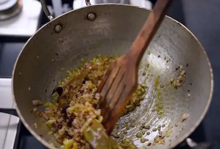 Chopped onions being cooked in a pan