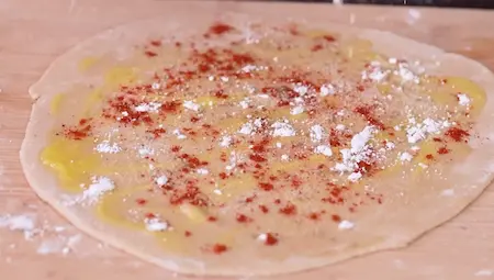 Step 3: adding red chilli and ghee to paratha