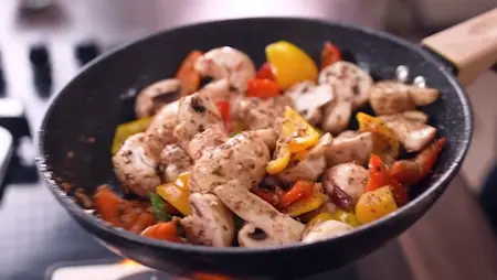 Step 3: sautéing mushrooms and capsicum for Dhabe Wala Kadhai Mushroom Recipe