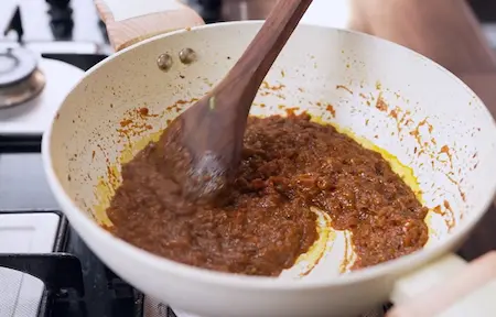 Step 4 final masala balance for Street Style Surti Paneer Ghotala Recipe