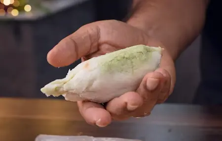 Shaping bread rolls with stuffing for Dahi Ke Sholey recipe candy shape