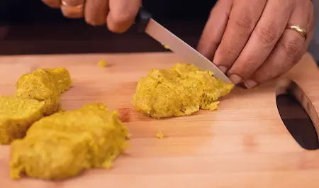 Step 5: Cutting steamed Dudhi Muthiya into equal pieces