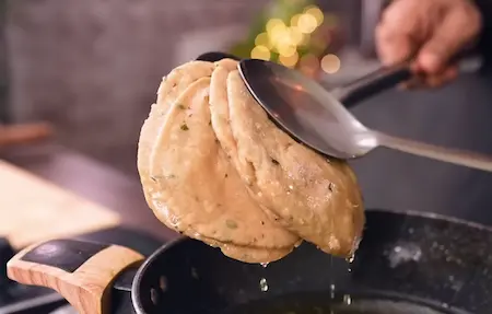 Step 3: First frying of Aligarh Kachori on medium flame until half-cooked without colour