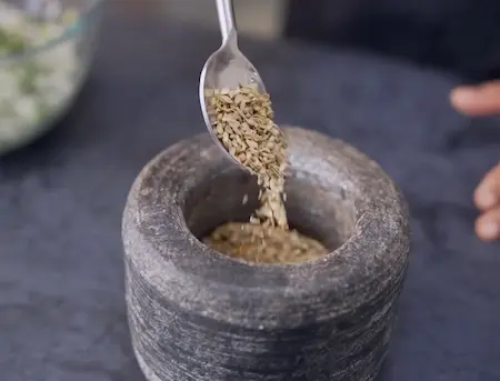 Roasting and grinding spices for Methi Wada