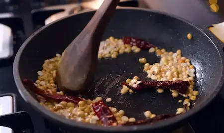 Preparing the spice mixture for red coconut chutney