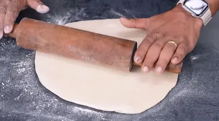 Rolling dough for Pinwheel Aloo Paratha