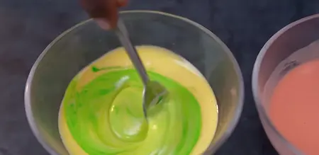 Tri-color boondi batter in three shades: orange, green, and yellow