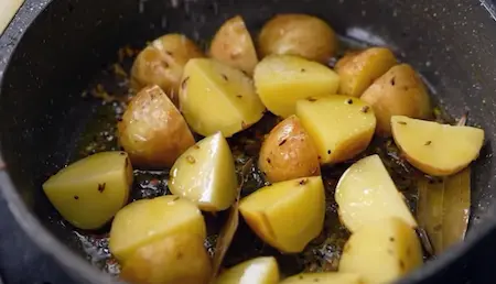 Potatoes cooking in the pan