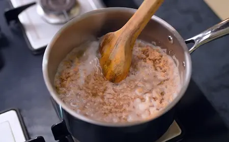 boiling soya granules in a pan with spices for soyabean seekh