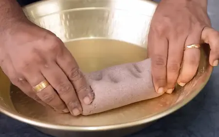 Preparing dough for Mandua Roti