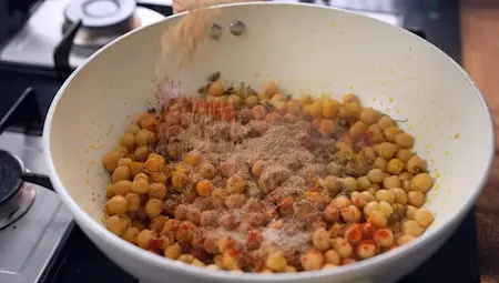 Step 4: sautéing chickpeas with spices for Halwai Style Chole Paneer Recipe
