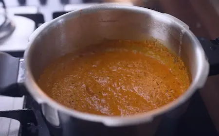 Step 2: Cooking vatan paste with Malwani masala and spices in pressure cooker for Kala Vatana Usal