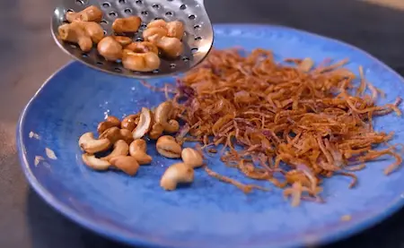 Fried onions and cashews for making korma paste