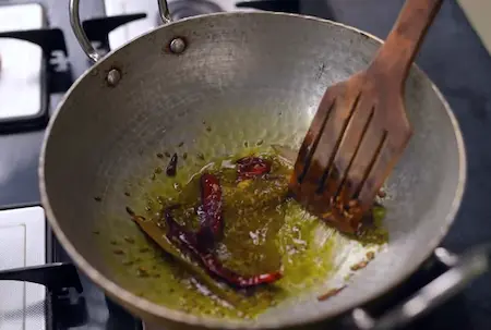 Spices being sautéed in oil