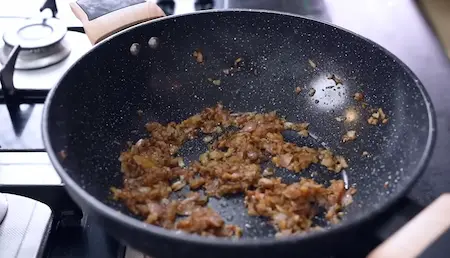 Step 2: cooking onions, garlic and chilli for corn masala sabzi