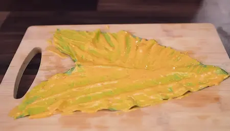 Step 3: coating and rolling leaves for Arbi Ke Patte Ki Sabji