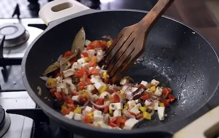 Step 3: preparing spice base for Palak Paneer Pulao with whole spices and paneer