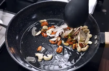 Step 2: roasting nuts and dry fruits for Meethe Chawal Recipe