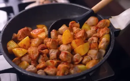 Step 4: Sautéing potato and soya chunks in mustard oil for Chana Soya Ki Sabji