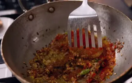 Adding spices to Aloo Chana Sabzi