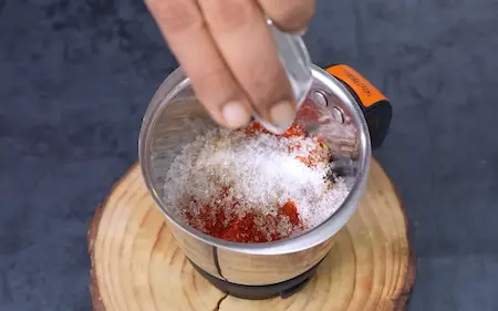 Roasting spices and making Dabeli masala for Dabeli Pakoda Sandwich