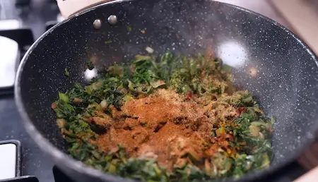 Step 5: seasoning Winter Saag Sabji with spices