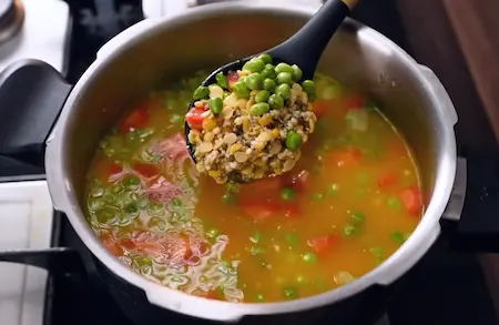 Step 2: pressure cooking grains and vegetables for Sardiyo Wali Special Khichdi