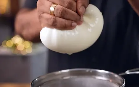 Preparing hung curd for Dahi Ke Sholey recipe stuffing using muslin cloth