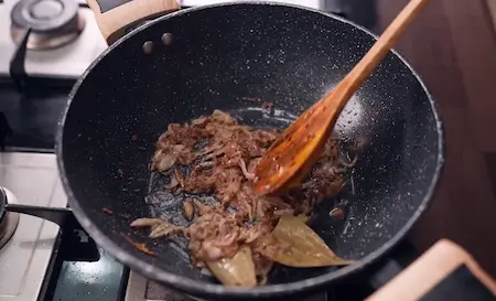 Step 4: Cooking golden onions and ginger garlic paste for Burhanpuri Dal tadka