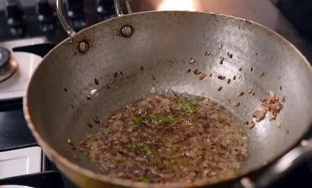 Cooking onions and ginger garlic paste for Aloo Chana Sabzi