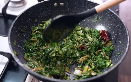 Step 4: adding winter greens in stages for Winter Saag Sabji
