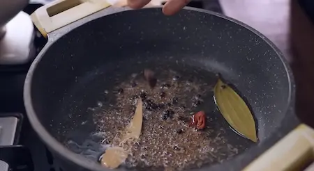 Step 5: adding whole spices for Pancham Style Puri Sabji