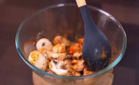 Step 1: Marinating mushrooms with spices for Pressure Cooker Mushroom Masala