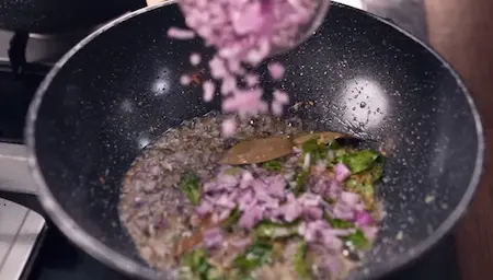 Tempering mustard seeds jeera curry leaves and onion for Vaal Chi Bhaji base