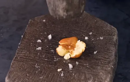 Pounding mooli and baby potatoes for Thechwani