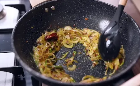 Step 3: sautéing garlic and onions for Winter Saag Sabji