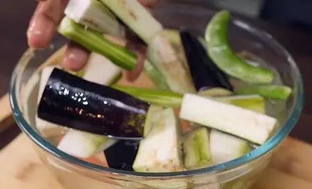 Step 1: Prepping all vegetables for Niramish Jhol — drumstick, brinjal, raw banana, potatoes and carrot