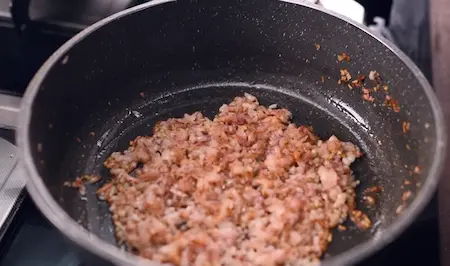 Step 2: Sautéing onions to golden brown for Soyabean Ki Sabzi masala base