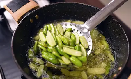 Step 1: Frying tendli and potatoes for Masala Tendli Aloo