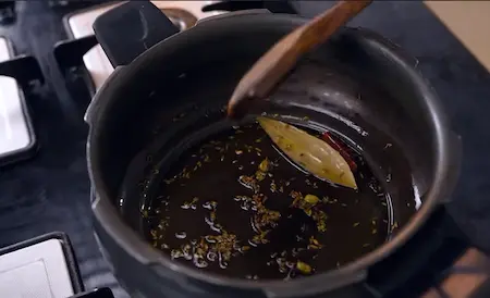 Preparing tempering in pressure cooker with whole spices