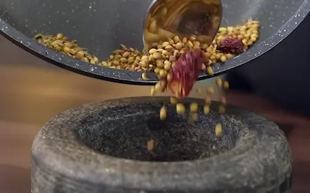 Step 2: Dry roasting and pounding spices for Creamy Pahadi-Style Rajma Madra Recipe